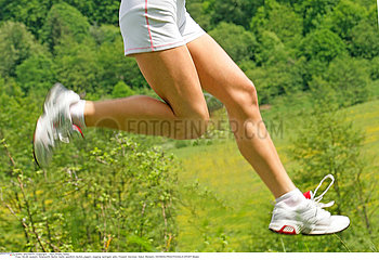 WOMAN PRACTISING A SPORT