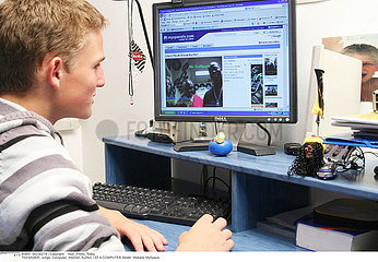TEENAGER AT A COMPUTER