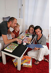 FAMILY PLAYING INDOORS