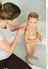 CHILD TAKING A BATH