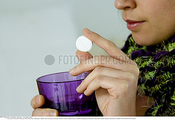 WOMAN TAKING MEDICATION