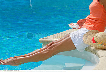 WOMAN TANNING IN SUMMER