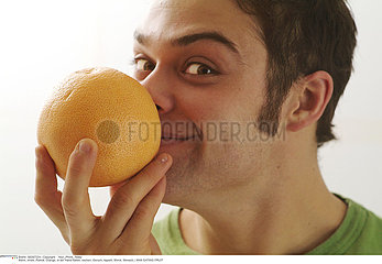 MAN EATING FRUIT