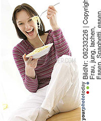 WOMAN EATING STARCHY FOOD