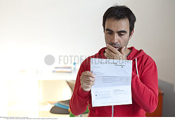 MAN FILLING OUT FORMS