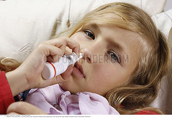 CHILD USING NOSE SPRAY