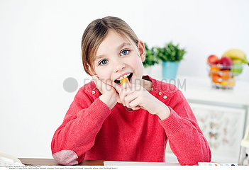 CHILD EATING VEGETABLE