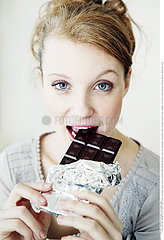 WOMAN EATING SWEETS