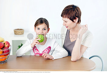 CHILD EATING FRUIT