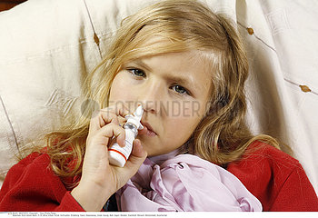 CHILD USING NOSE SPRAY