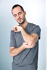 MAN WITH PAINFUL ELBOW