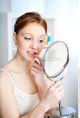 WOMAN WITH MIRROR