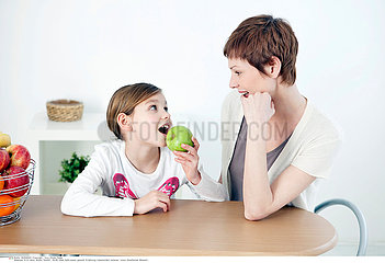 CHILD EATING FRUIT