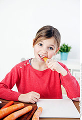 CHILD EATING VEGETABLE