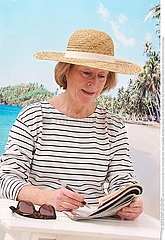 ELDERLY PERSON AT THE SEASIDE