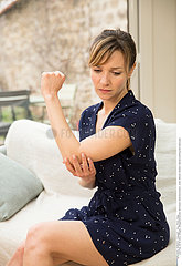 WOMAN WITH PAINFUL ELBOW
