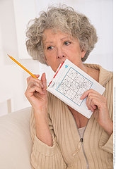 ELDERLY PERSON PLAYING A GAME