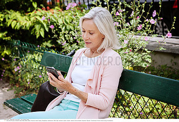 ELDERLY PERSON WITH PHONE