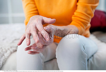 ELDERLY PERSON WITH PAINFUL HAND