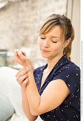 WOMAN WITH PAINFUL WRIST