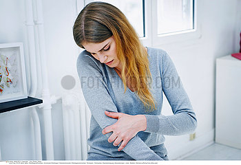 WOMAN WITH ELBOW PAIN