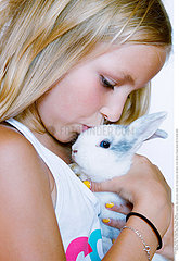 CHILD WITH ANIMAL