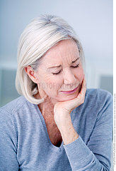 ELDERLY PERSON WITH A TOOTHACHE