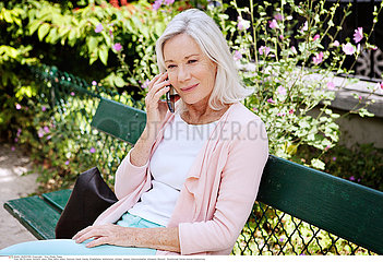 ELDERLY PERSON WITH PHONE