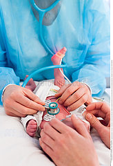 A paediatrician takes care of a premature baby in the neonatalogy department. Hospital. Aix en Provence. February