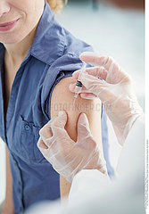 VACCINATING A WOMAN