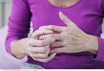 ELDERLY PERSON WITH PAINFUL HAND
