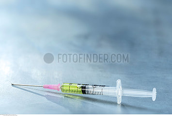 Syringe closeup isolated on grey background