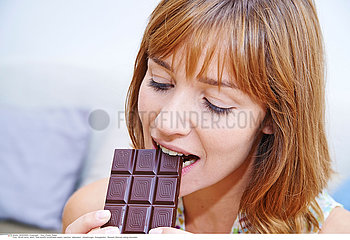 WOMAN EATING SWEETS