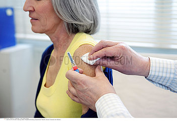 VACCINATING AN ELDERLY PERSON
