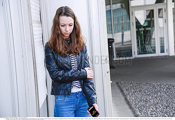 ADOLESCENT WITH PHONE