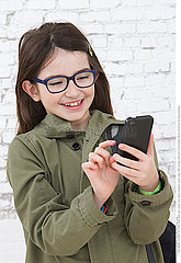 CHILD WITH PHONE