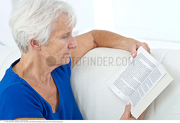 ELDERLY PERSON READING