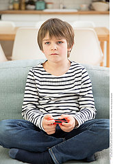 CHILD PLAYING VIDEO GAME