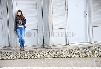 ADOLESCENT WITH PHONE