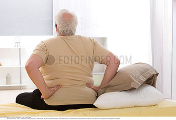 ELDERLY PERSON WITH LOWER BACK PAIN