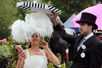 Royal Ascot  Fashion  woman and man with hats at the racecourse