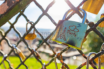 France  Paris (75) 18th Arr  Montmartre  Custom of love padlocks. After the Archeveche and the Arts bridges  crumbling under the padlocks  Montmartre also finds itself confronted with these invasive metal oaths  hung for years by couples in love.