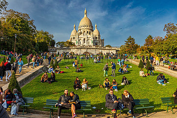 France  Paris (75) 18th Arr. Montmartre  Grandes-Carrieres district  Tourists on the lawns of the stairs of Square Louise Michel which lead to the Sacre-Coeur basilica