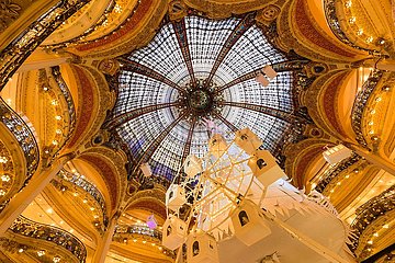 France  Paris  75009 (9th arrondissement)  Boulevard Haussman. Christmas at Galleries Lafayette Haussman interior with glass cupola and arches. Department Store