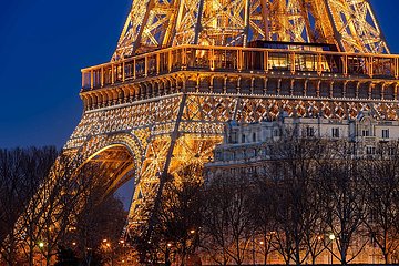 France  Paris  75007 (7th arrondissement)  Champs de Mars. Close-up of the Eiffel Tower illuminated at twilight