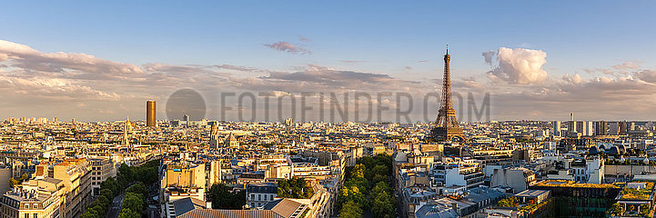 France  Paris  75016 (16th arrondissement). Panoramic summer view of Paris rooftops at sunset with the Eiffel Tower