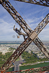 France. Paris (75) On the occasion of its 120th anniversary (2010)  the Eiffel Tower is beautiful! makeup by an international team: 26 painters climbers