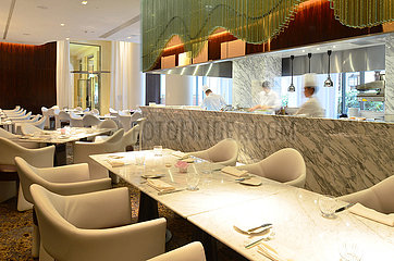 France. Paris 8e. The hotel Prince de Galles  located avenue Georges V  has Stephanie Le Quellec for executif chef. The kitchen is inside the restaurant Le Scene decorated by the designer Bruno Borrione