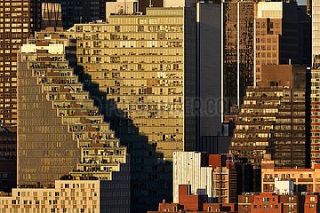United States  New York City  Manhattan  Midtown. The Mercedes House apartment complex building with its zigzag shape and terraces at sunset