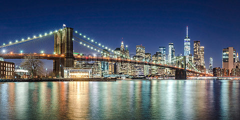 United States  New York City  Brooklyn. The skyscrapers of Lower Manhattan and the Brooklyn Bridge in evening with the East River (panoramic)